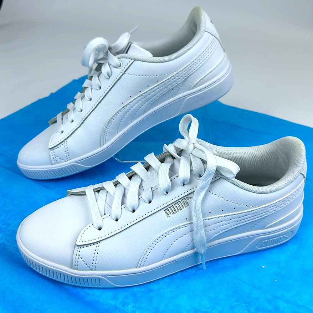 Puma White Sneakers New. Size 8.5 Women’s. Silver Puma logos.